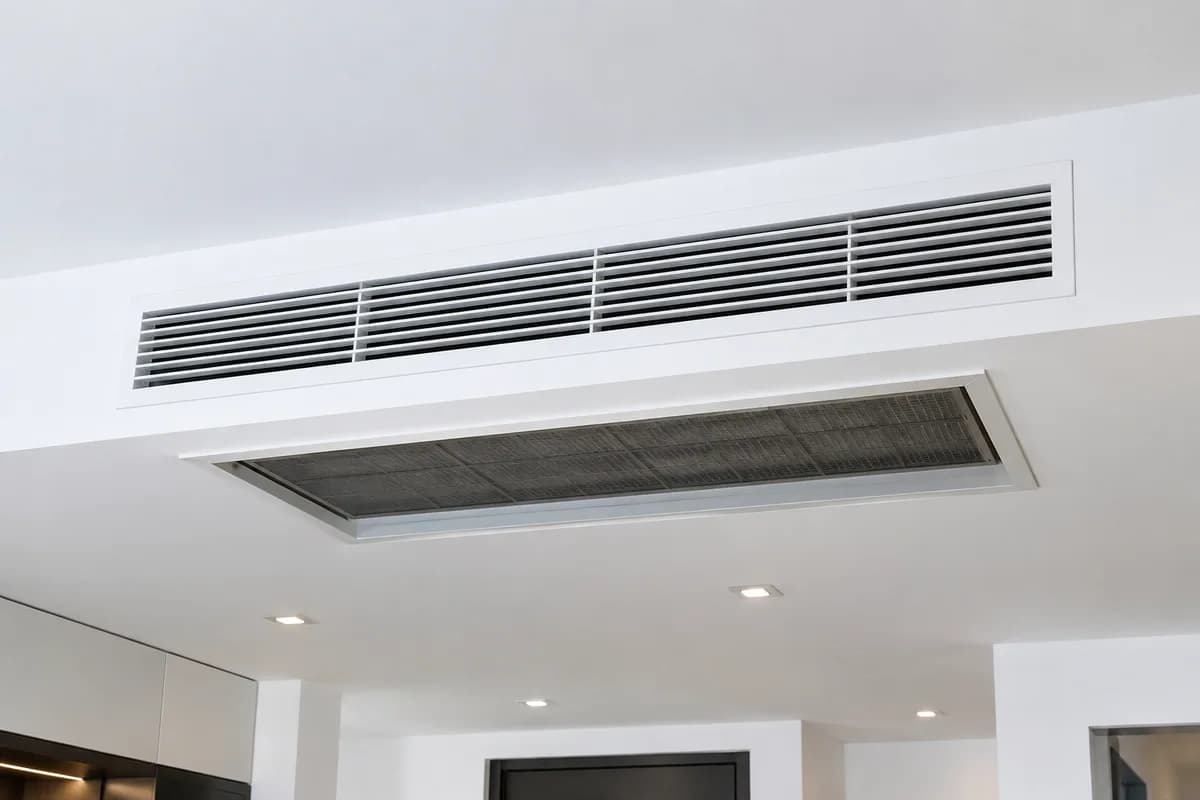 Ducted split system ductwork above a ceiling
