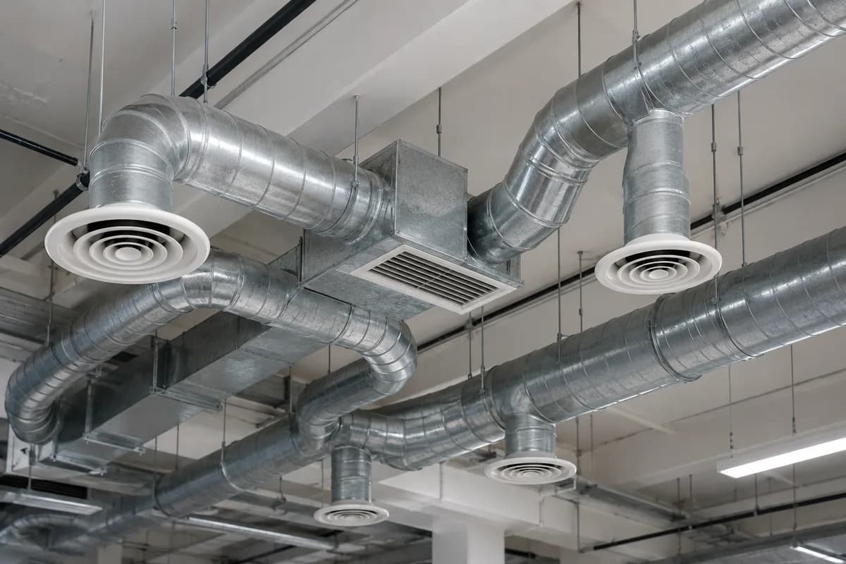 Extract and ventilation ductwork in a ceiling void